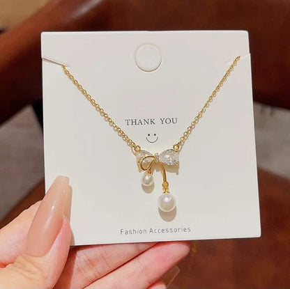 gold plated bow diamond pendant
