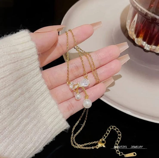 gold plated bow diamond pendant