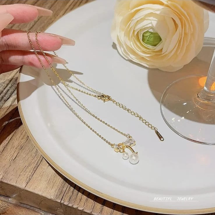 gold plated bow diamond pendant